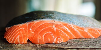 Fresh Raw Salmon Fillet Close Up On Rustic Wooden Surface