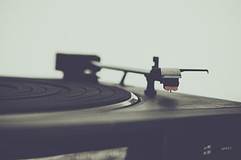 Close-up of vinyl record player tonearm and needle