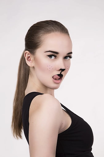 Playful Woman with Cat Makeup and Black Tank Top