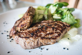 Grilled Beef Steak with Green Salad Close Up