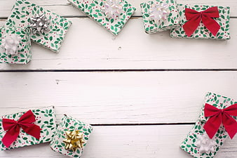 Christmas Gift Boxes Flat Lay With White Wooden Background
