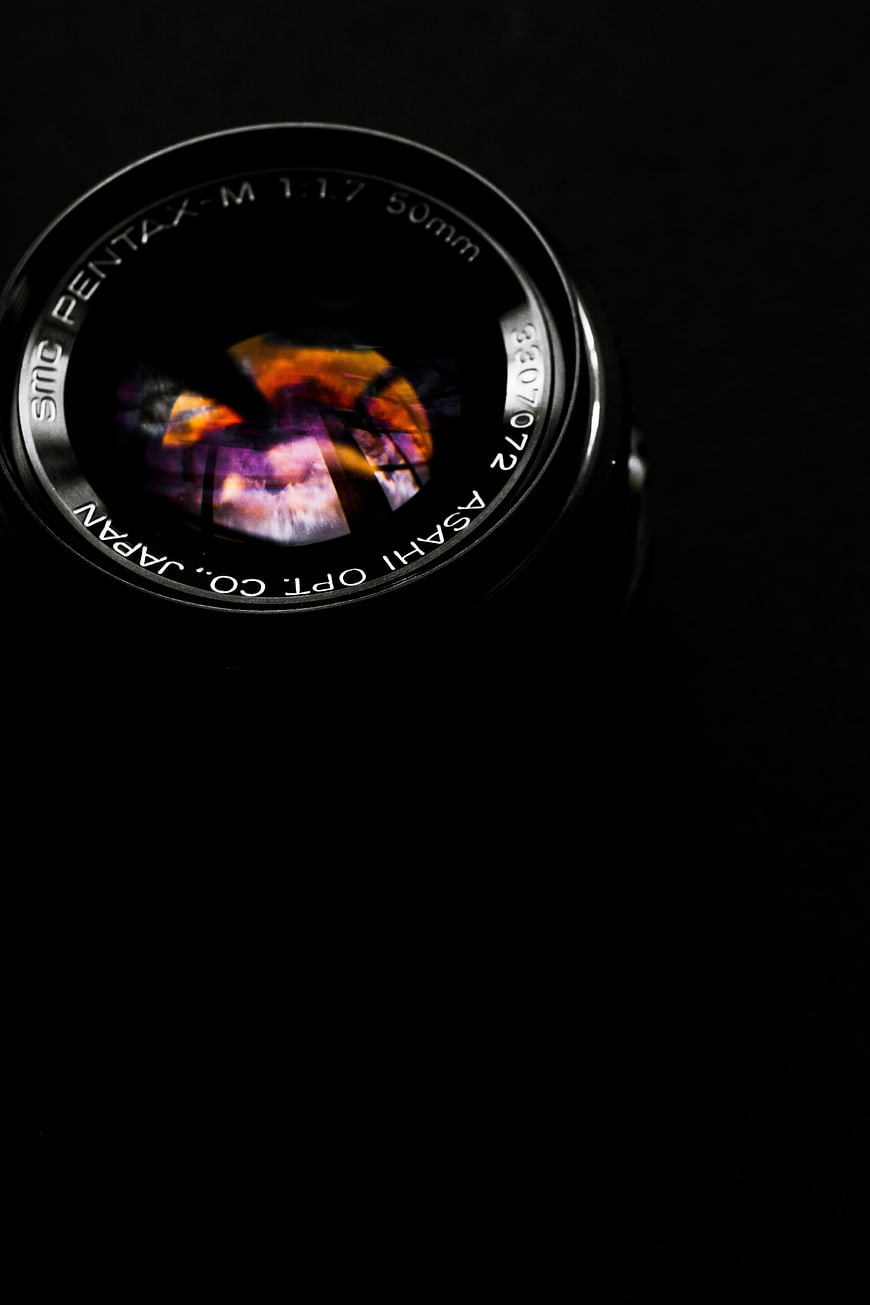 Close-up of Pentax Camera Lens with Reflection