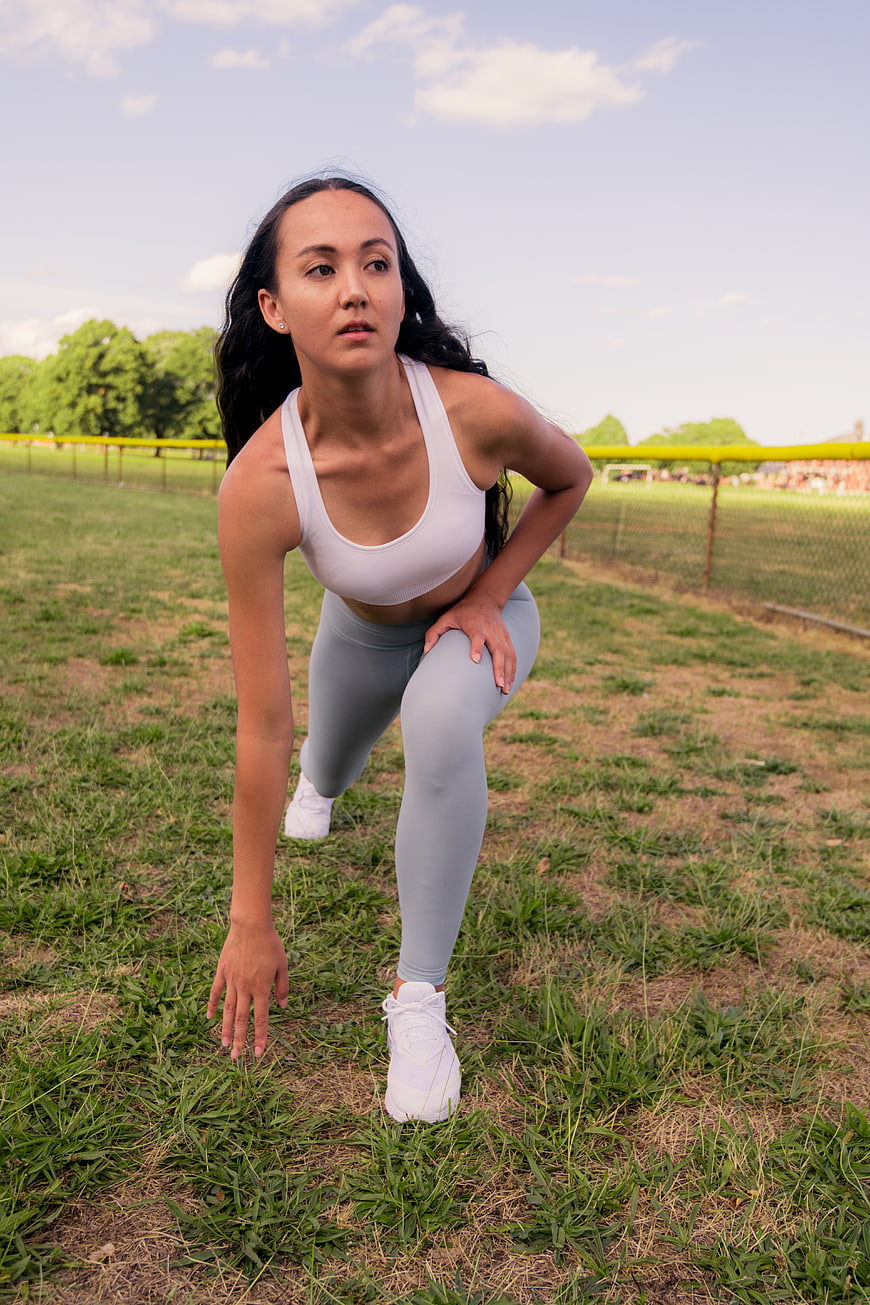 Athletic Woman Stretching in Outdoor Park