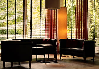 Modern Lounge Interior With Black Leather Seating And Floor Lamp