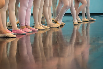 Ballet dancers legs and feet in studio