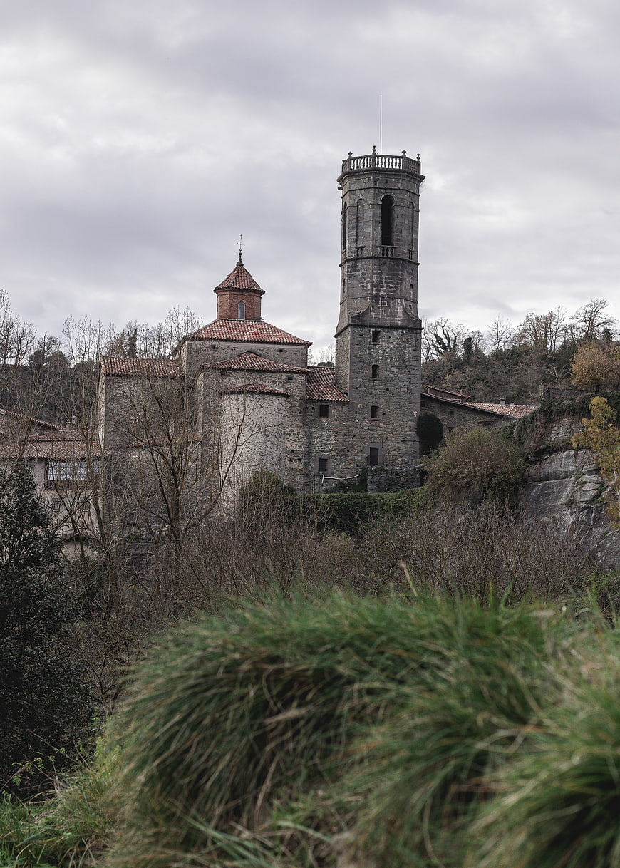 Ancient stone church tower on a hillside in Spain