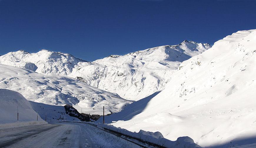 Snowy Mountain Road in Winter Landscape