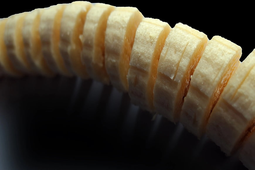 Close-up of sliced banana on black background