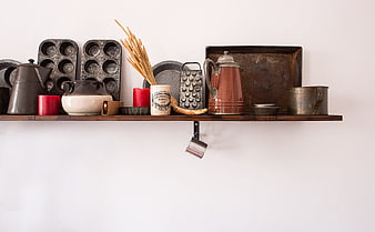 Rustic Kitchen Shelf With Vintage Copperware And Antique Baking Tools