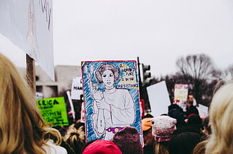 Protest sign with Star Wars character and women's rights slogan