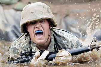 Soldier in Mud with Rifle and Mouthguard