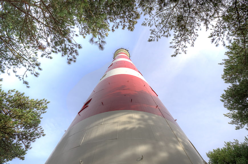 Low angle view of red and white lighthouse tower