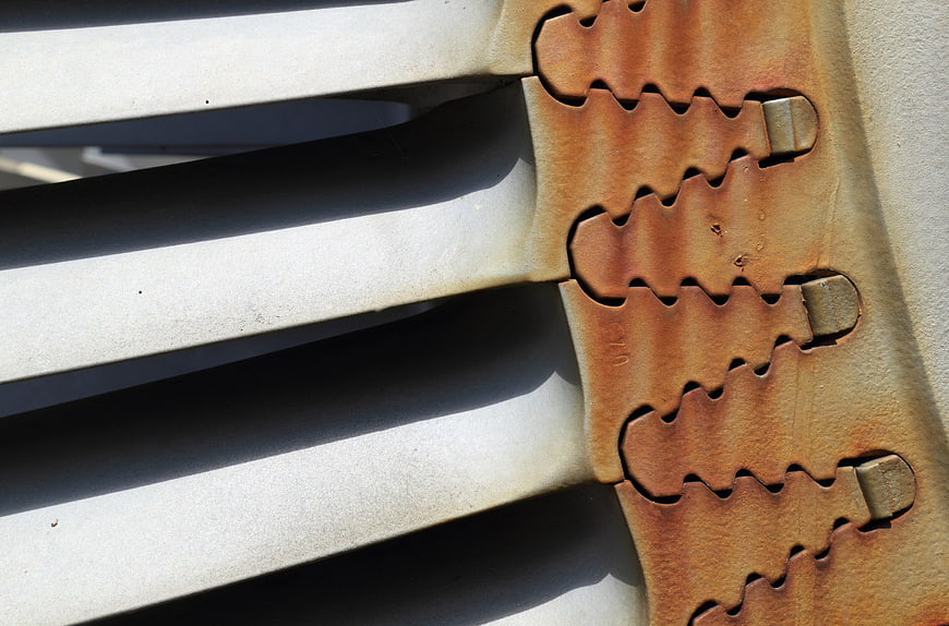 Close-up of turbine blade locking mechanism with dovetail attachment