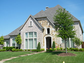 Modern brick and stone suburban home exterior
