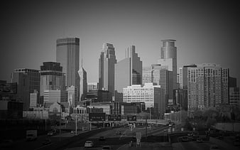 Black and white skyline of Minneapolis with highway traffic