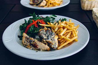 Grilled Chicken with Fries and Salad on White Plate