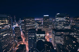 Aerial Night View of Downtown City Skyline with Illuminated Skyscrapers