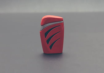 Red plastic container with silver accent on gray background