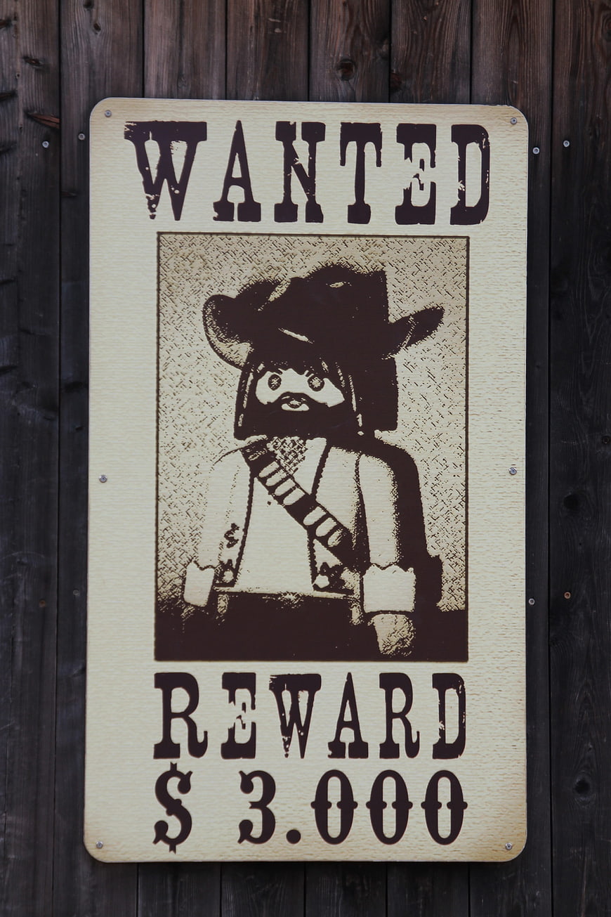 Vintage Wanted Poster with Toy Cowboy Figure
