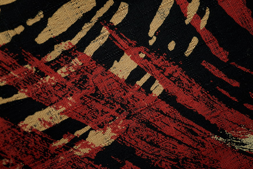 Abstract Red Black Beige Woven Fabric Texture Close Up