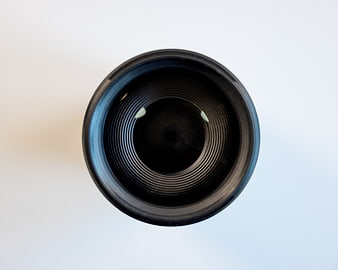 Close-up of camera lens aperture blades on white background