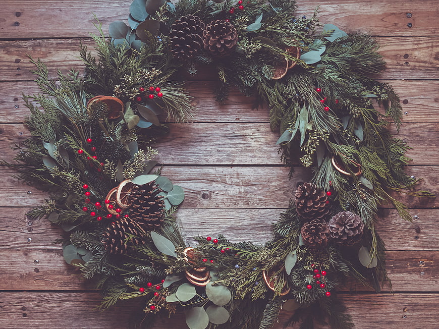 Rustic Christmas Wreath on Wooden Background