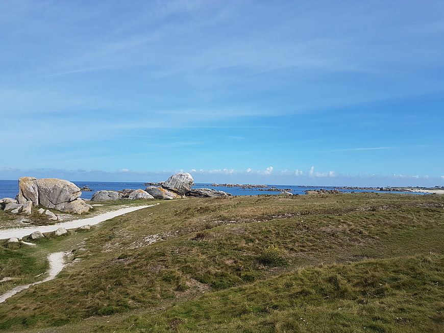 Scenic Brittany Coastline with Granite Boulders and Blue Sky