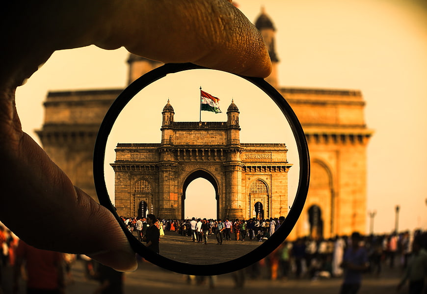 Creative Circular Frame View of Gateway of India with Indian Flag