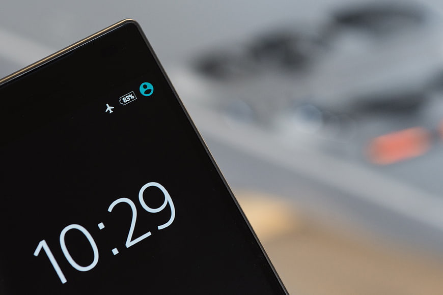 Close-up of Smartphone Screen Displaying Time and Battery