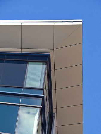 Modern Building Corner with Blue Sky Background