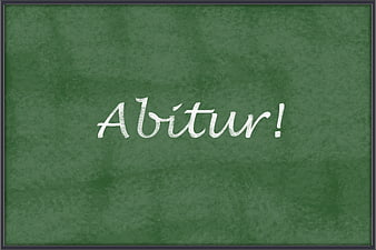 Abitur written in white chalk on a green blackboard