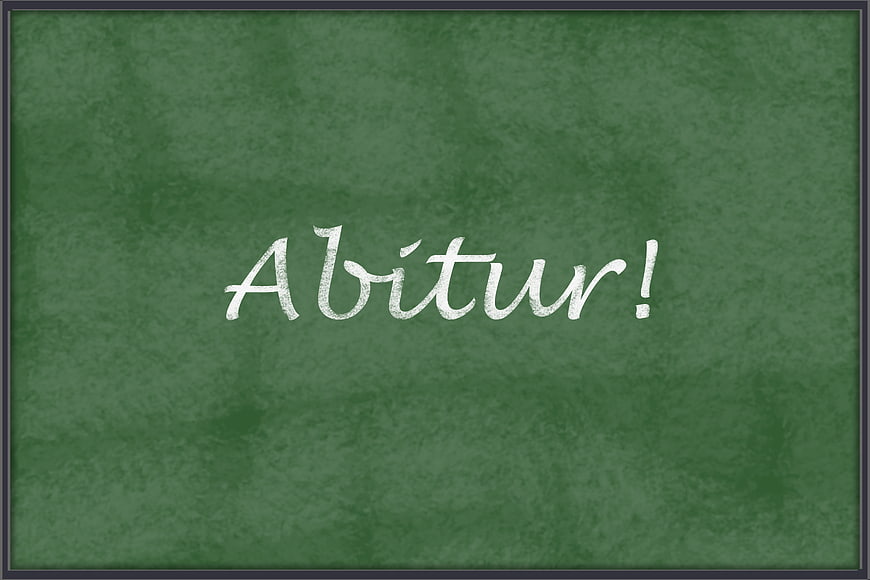 Abitur written in white chalk on a green blackboard
