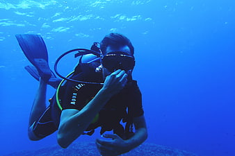 Scuba Diver Underwater in Blue Ocean