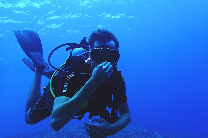 Scuba Diver Underwater in Blue Ocean