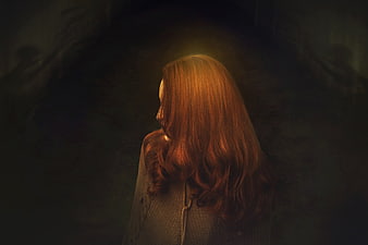 Mysterious Redhead Woman in Dark Moody Atmosphere
