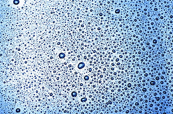 Blue water droplets on glass background texture