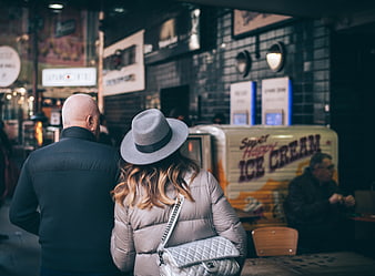 Couple walking past ice cream truck at night