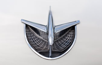 Close-up of vintage chrome car hood ornament