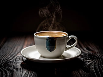 Steaming Hot Coffee in Artisan Ceramic Cup on Dark Wood