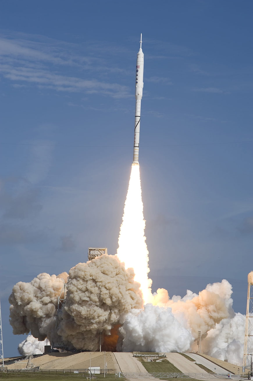 Ares I-X Rocket Launching into Blue Sky with Smoke