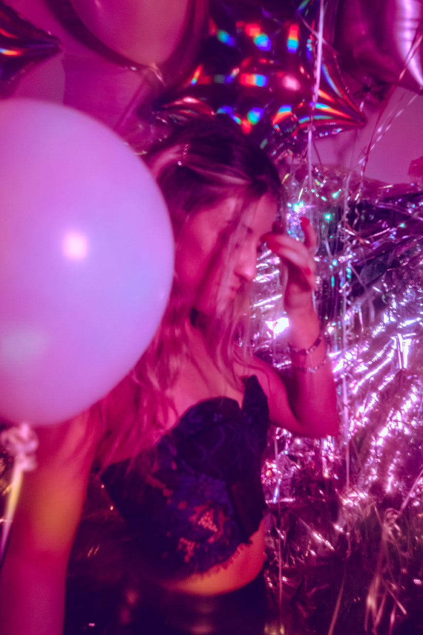 Woman at Neon Party with Balloons