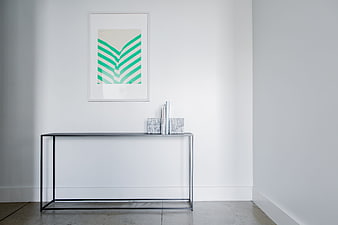 Minimalist interior with console table and abstract art