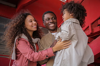 Happy African American Family Portrait on Red Stairs