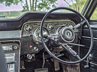 Vintage car interior with classic steering wheel and dashboard