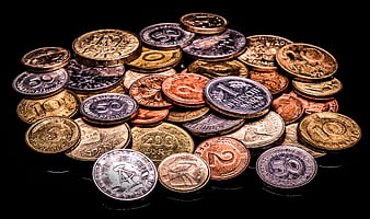 Collection of vintage European coins on a black background