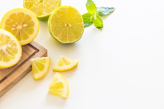 Fresh Sliced Lemons and Mint on White Background