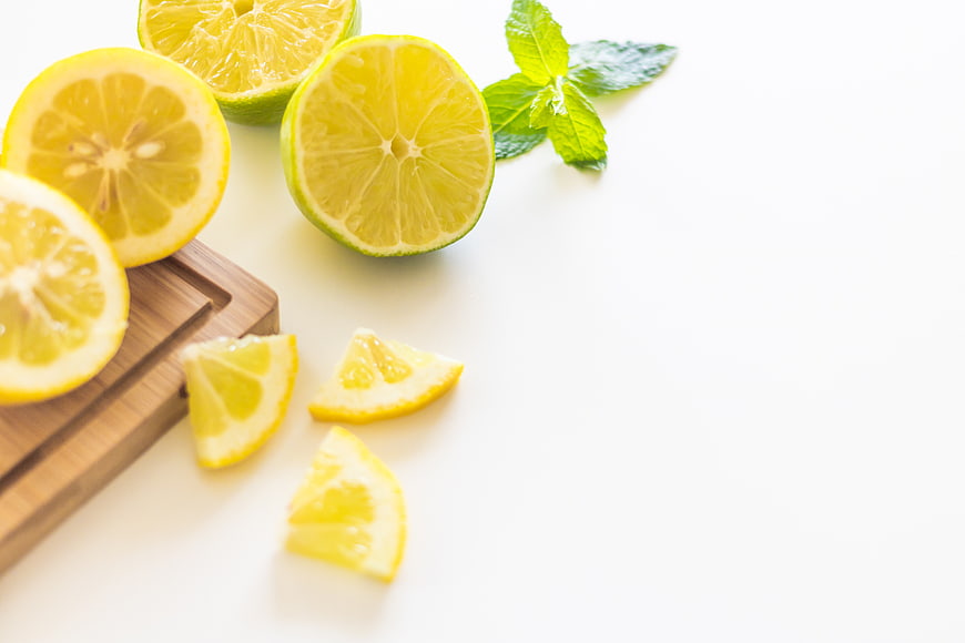 Fresh Sliced Lemons and Mint on White Background