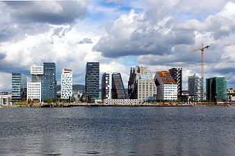 Oslo waterfront skyline with modern architecture and construction crane