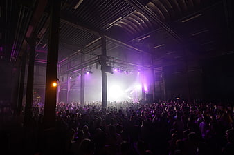 Crowded Music Concert in Industrial Warehouse Venue