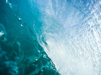 Close-up of a crashing ocean wave with turquoise water